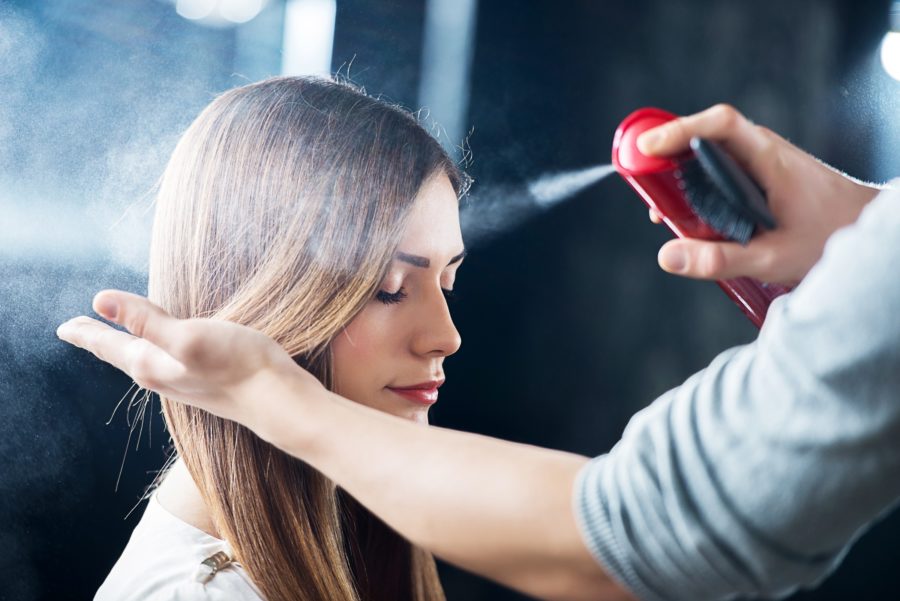 girl at hairstalyst using Hairspray