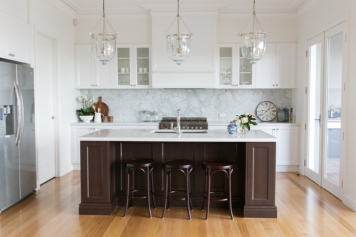 hamptons style kitchen with wooden stools