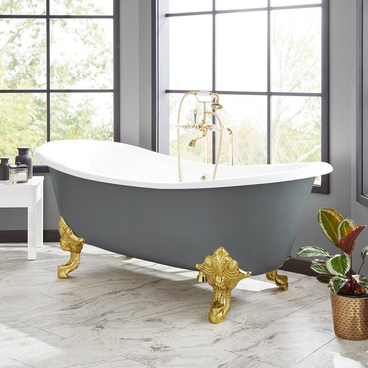 picture of a clawfoot bathtub in front a window in a bathroom