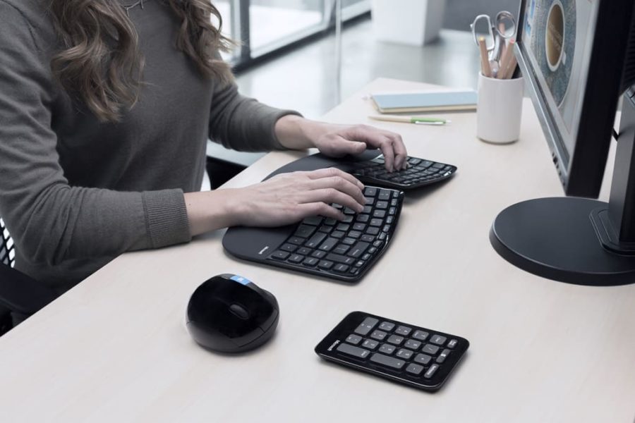 women sitting properly ergonomic keyboard wrist rest