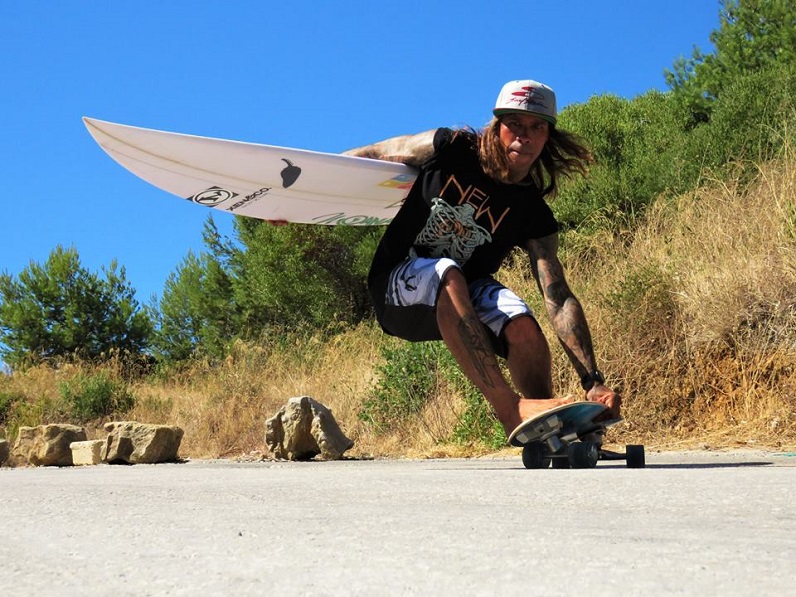 a guy skating with surfskate