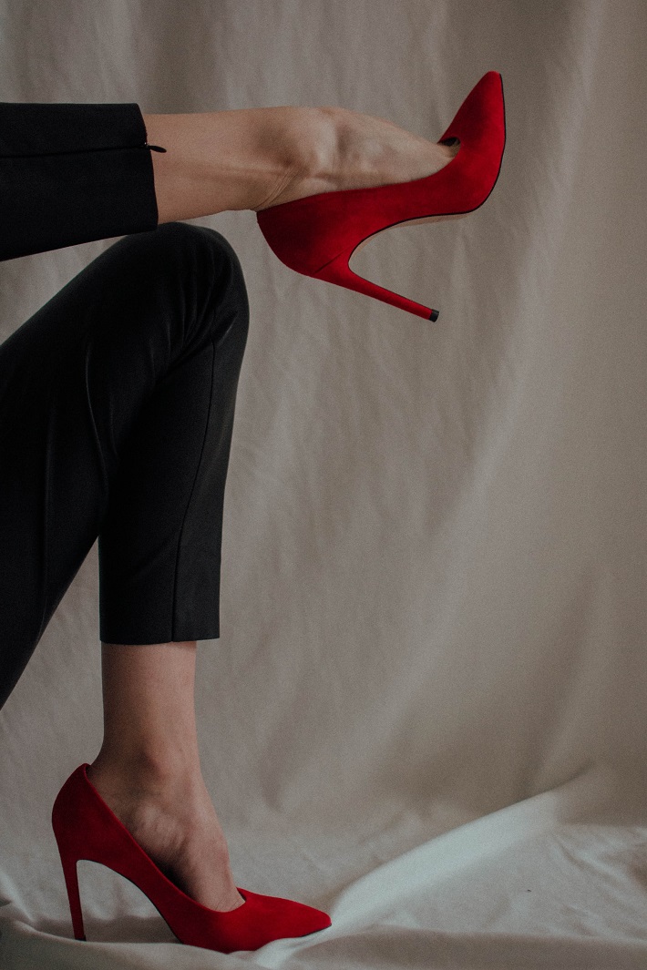 picture of a legs with a pair of red comfortable high heels 