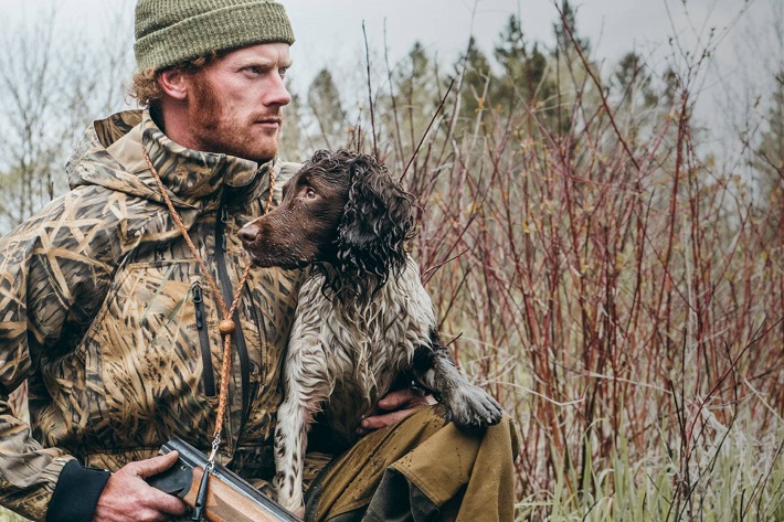 Close-up of a hunter with his dog 