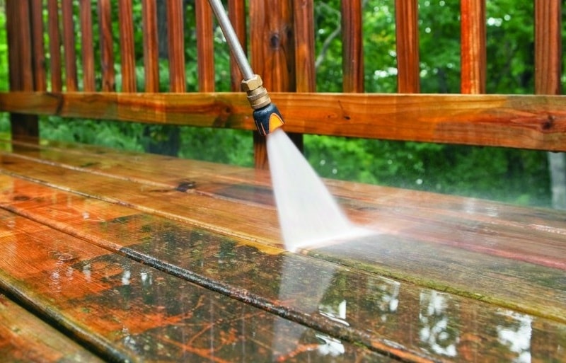 Power washing wooden deck