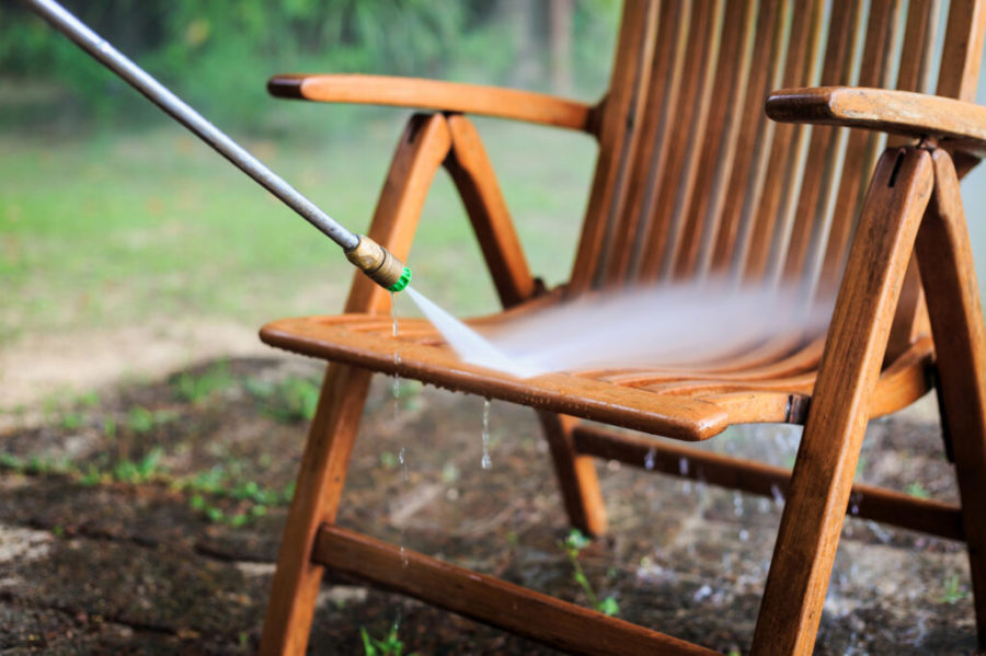 Wooden chair cleaning with high pressure water