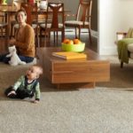 baby sitting on a carpet