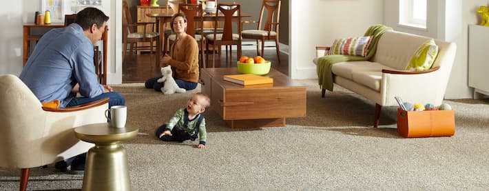 baby sitting on a carpet