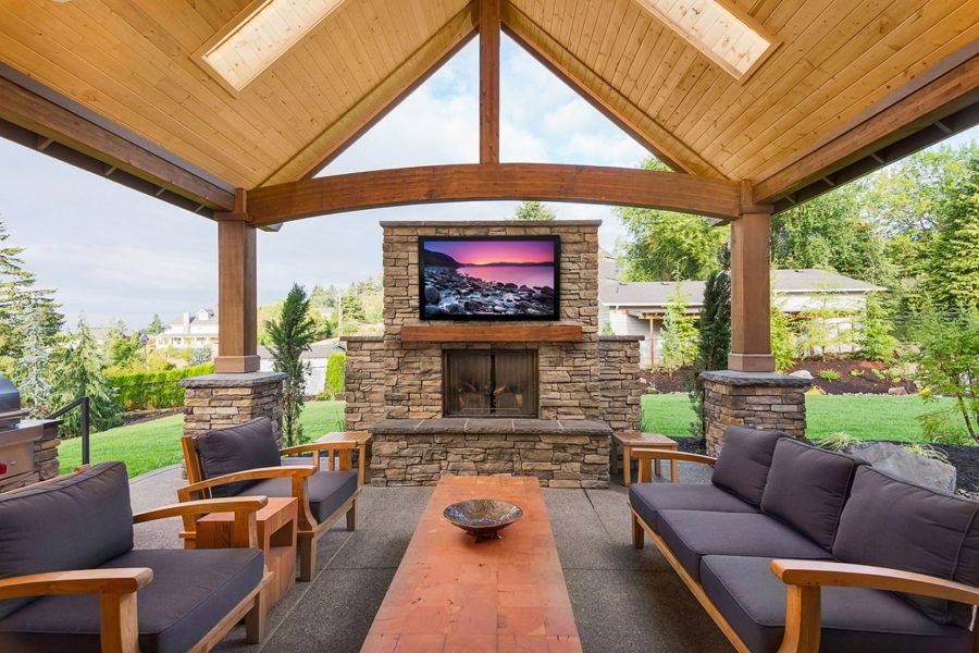 Patio with gray furniture and TV
