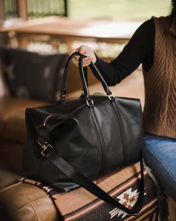 woman with black travel bag