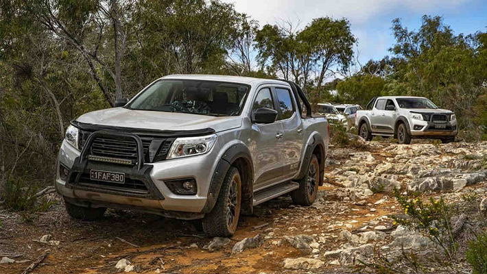 Nissan Navara D40 driven in nature with with other SUV in off road team