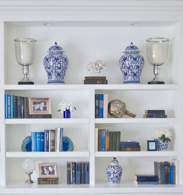 bookshelf decorated with Hampton homewares
