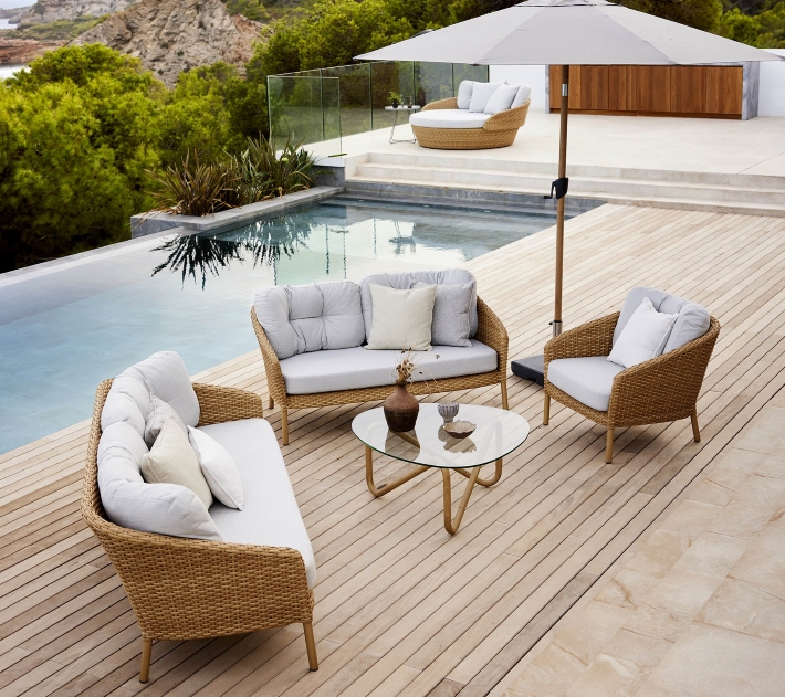 patio with outdoor furniture by a pool