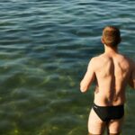 man in the sea in swimwear