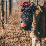 man traveling with survival bag